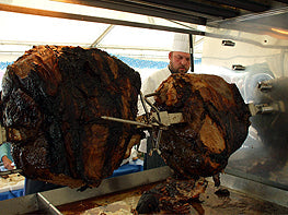 Rotisserie Whole Steamship of Beef. Flame Show Cooking Catering or Drop Off Catering