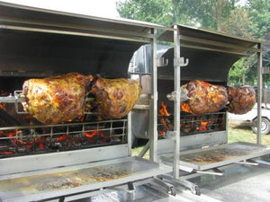 Rotisserie Whole Steamship of Beef. Flame Show Cooking Catering or Drop Off Catering