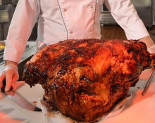 Load image into Gallery viewer, Rotisserie Whole Steamship of Beef. Flame Show Cooking Catering or Drop Off Catering
